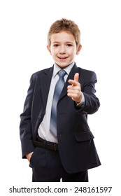 Handsome Smiling Child Boy In Business Suit Index Finger Pointing Direction Way Or Campaign Agitating Choice White Isolated