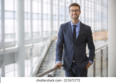Handsome smiling confident businessman portrait - Shutterstock ID 217671772