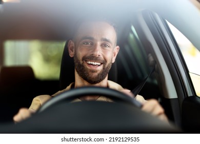 Handsome smiling latin man driving a car. Car sharing concept  - Shutterstock ID 2192129535
