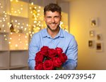 Handsome, smiling man confidently holding lush bouquet of red roses in front of a sparkling backdrop of festive lights, symbolizing romance