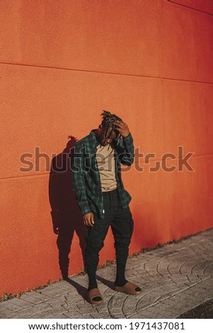 Similar – Black young man listening to music in a sunny day