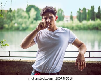 Handsome Stylish Young Man Smoking Cigarette Outside