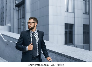 Handsome successful businessman in elegant suit outdoors - Shutterstock ID 737478952