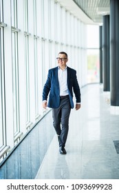 Handsome And Sucessful Senior Business Man Walking In Modern Office