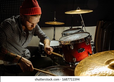 handsome talented guy play on drums, caucasian young man keen on music, preparing for concert, rock and roll performer. music, instruments concept - Powered by Shutterstock