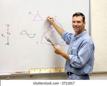 A Handsome Teacher Drawing A Mathematical Diagram On The White Board.