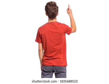 Handsome Teen Boy With His Back Turned To Camera, Pointing To Something, Isolated On White Background