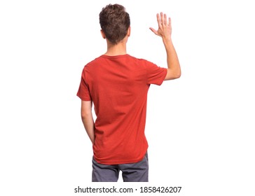 Handsome Teen Boy With His Back Turned To Camera, Pointing To Something, Isolated On White Background