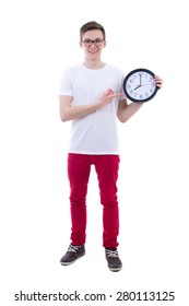 handsome teenage boy showing office clock isolated on white background