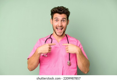 Handsome Teenager Feeling Happy And Pointing To Self With An Excited. Nurse Concept