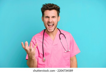 Handsome Teenager Looking Angry, Annoyed And Frustrated. Nurse Concept