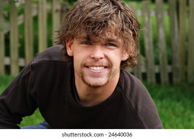 Handsome Twenty-one Year Old Male College Student With Tousled Hairstyle.  Casual Outdoor Portrait With Shallow Dof.