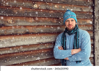 Handsome Unshaven Man In Winter Clothes Standing Near His House