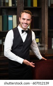Handsome Waiter Welcoming Client In A Fancy Restaurant