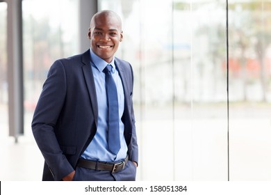 handsome young african american businessman in office - Powered by Shutterstock