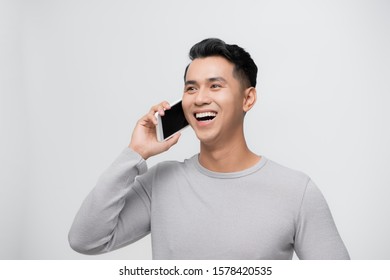 Handsome Young Asian Man Take A Call On White