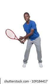 Handsome young black African American teenage man playing tennis