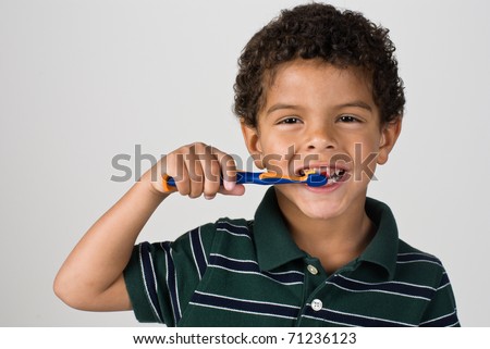 Handsome Young Boy Brushing Teeth