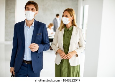 Handsome Young Business Couple Walking Together While Wear Protective Masks To Prevent   Corona Viruus At Office Space