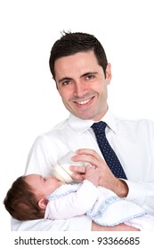 Handsome Young Business Man Feeding Daughter With Milk Bottle. Isolated On White.