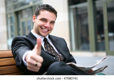 Handsome Young Business Man Giving Thumbs P, Outside Office Building