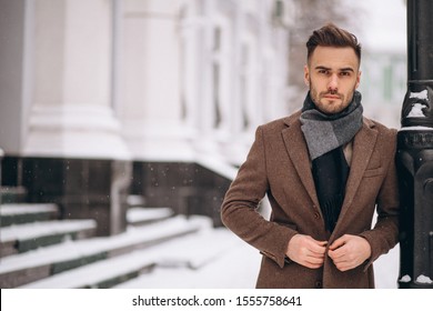Handsome young business man outside in winter