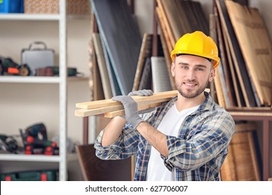 Handsome Young Carpenter In Workshop