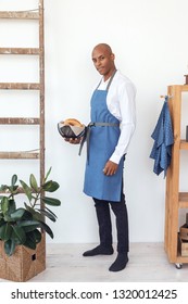 Handsome Young Chef Wearing Linen Apron, Preparing Food. Brazilian Model.