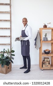 Handsome Young Chef Wearing Linen Apron, Preparing Food. Brazilian Model.