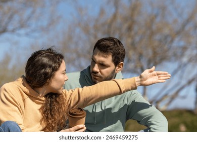 handsome young couple argue in a park by the beach, couple crisis, teenagers, divorce - Powered by Shutterstock