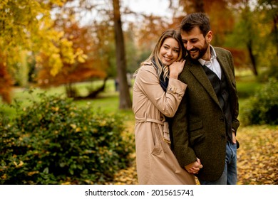 Handsome Young Couple In The Autumn Park