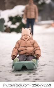 Handsome young dad and his little cute daughter are having fun outdoor in winter. Enjoying spending time together. Family concept. High quality photo - Shutterstock ID 2245773553