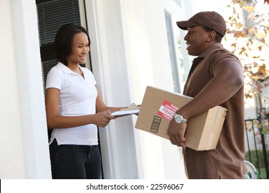 A Handsome Young Delivery Man Delivering A Package To House