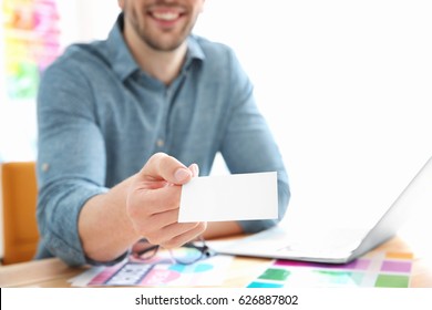 Handsome Young Designer With Business Card In Office, Closeup