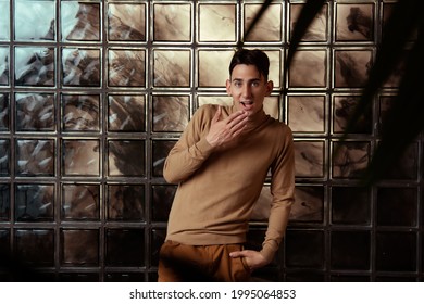 Handsome Young Guy Posing By The Window. Model Photographs In Home Interior. Glamor And Haute Couture.