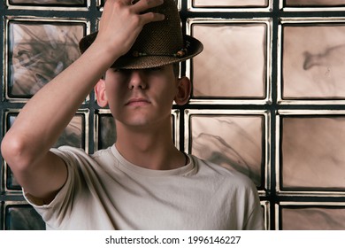 Handsome Young Guy Posing By The Window. Model Photographs In Home Interior. Glamor And Haute Couture.