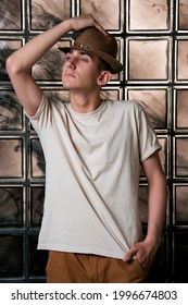 Handsome Young Guy Posing By The Window. Model Photographs In Home Interior. Glamor And Haute Couture.