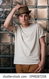 Handsome Young Guy Posing By The Window. Model Photographs In Home Interior. Glamor And Haute Couture.