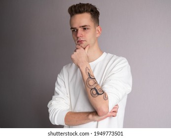 Handsome Young Guy With Snake Tattoo On His Arm.