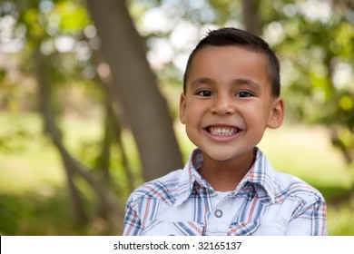 Handsome Young Hispanic Boy Having Fun In The Park.