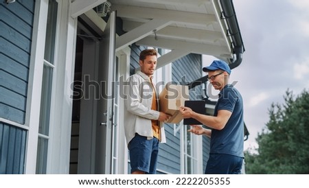 Handsome Young Homeowner Receiving an Awaited Parcel from a Cheerful Courier. Postal Service Worker Comes to the House to Make a Door to Door Delivery and Get a POD Signature on Tablet.