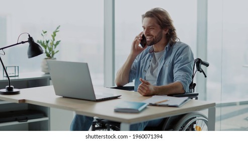 Handsome Young Invalid Disabled Man Business Guy Talking On Mobile Phone In Contemporary Office. Worker. Person With Disabilities. Phone Call.