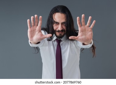 Handsome Young Italian Man Is Gesturing Stop Sign With His Hands.