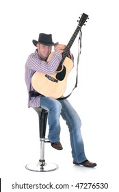Handsome young male country & western singer, performer with guitar.  Studio shot, white background.