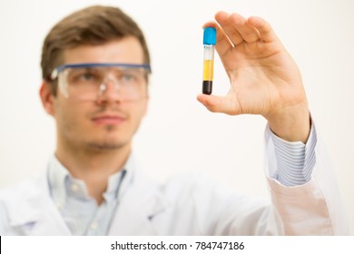 Handsome Young Male Scientist Wearing Protective Glasses Working With Test Tubes At The Modern Laboratory Copyspace Examination Survey Research Profession Employee Occupation Virus