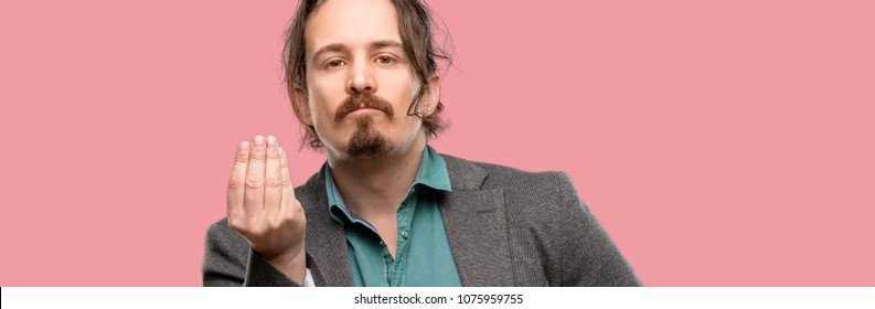 Handsome Young Man Angry Gesturing Typical Italian Gesture With Hand, Looking To Camera