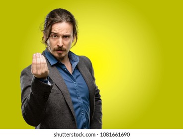 Handsome Young Man Angry Gesturing Typical Italian Gesture With Hand, Looking To Camera