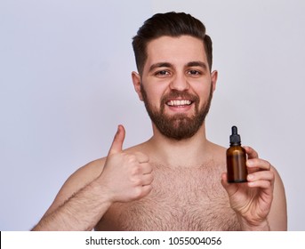 Handsome young man with beard oil