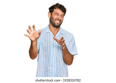 Handsome Young Man With Beard Wearing Casual Fresh Shirt Disgusted Expression, Displeased And Fearful Doing Disgust Face Because Aversion Reaction. With Hands Raised 