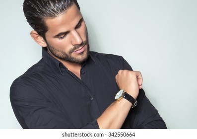 Handsome Young Man In Black Dress Shirt Wearing A Wristwatch 